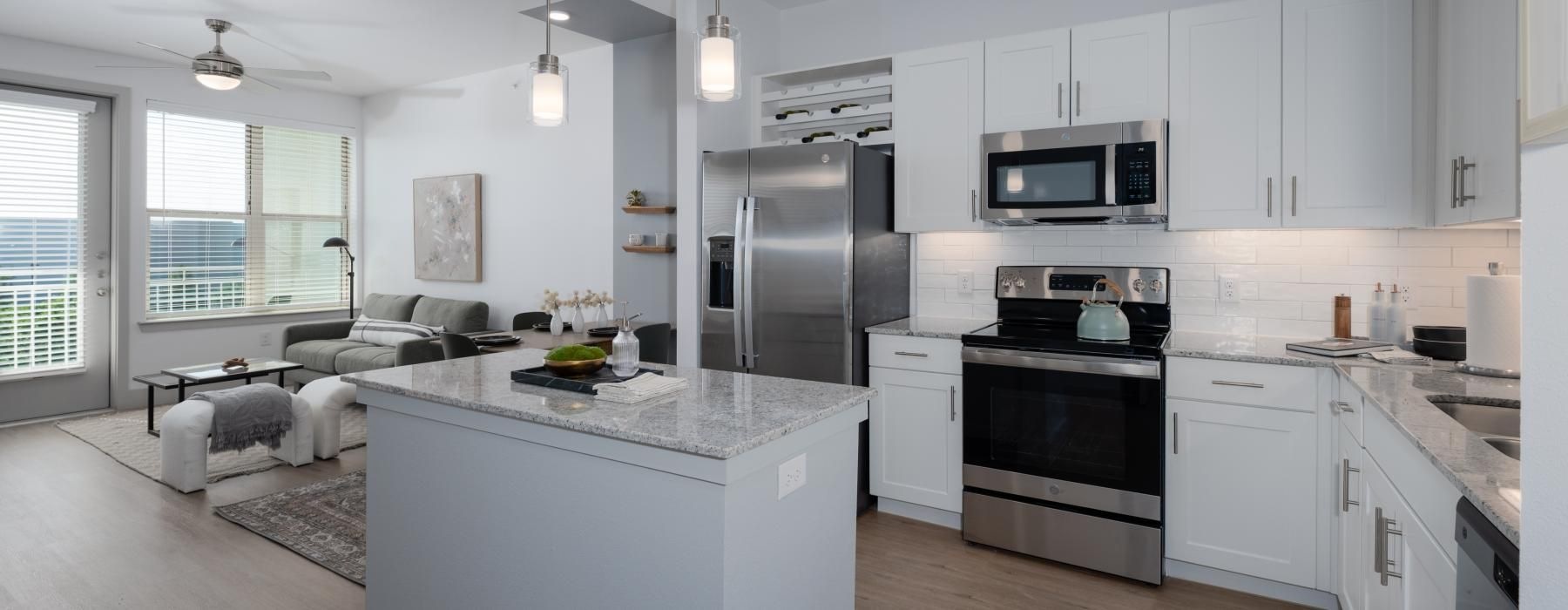 a kitchen with white cabinets